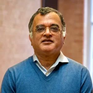 Man with blue shirt and sweater